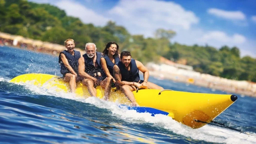 Tourists riding a banana boat during water sports in Bentota, Sri Lanka