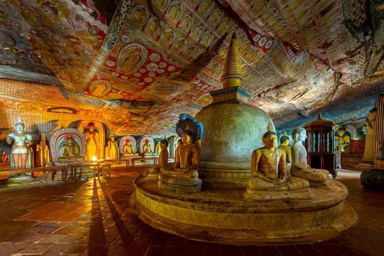 Interior of Dambulla Cave Temple with ancient Buddha statues and Buddhist murals in Sri Lanka