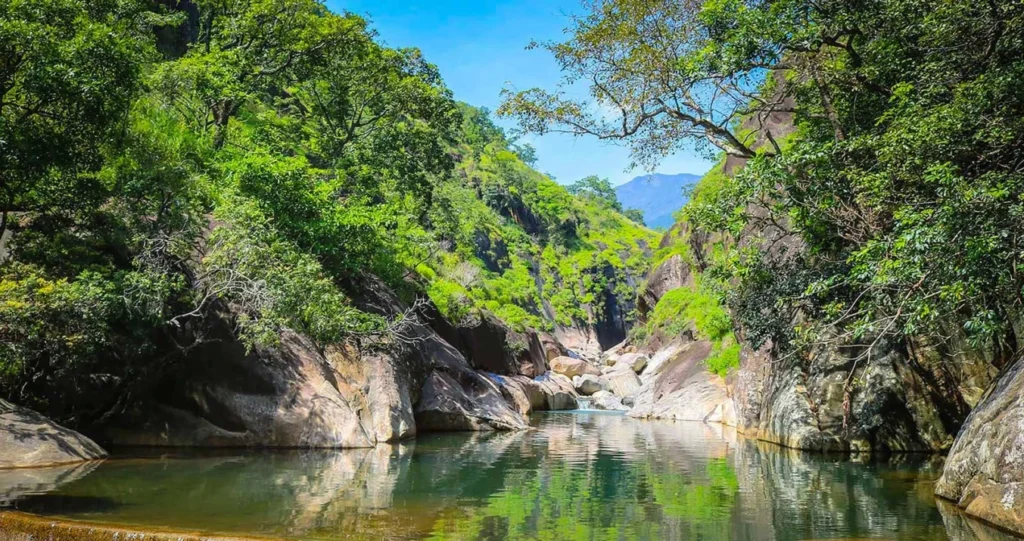 Natural rock pools and waterfalls in Belihuloya surrounded by rainforest in Sri Lanka