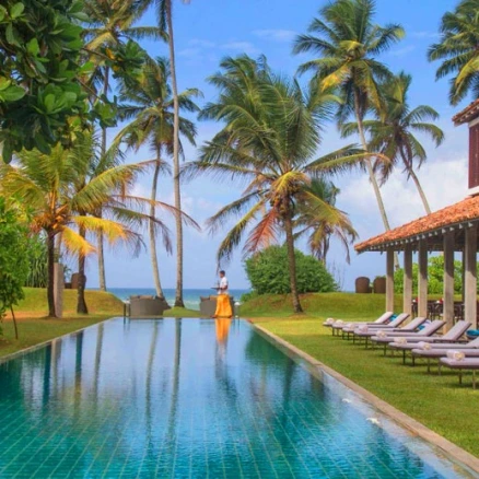 Luxury beachfront villa resort in Sri Lanka with infinity pool, palm trees, and ocean views