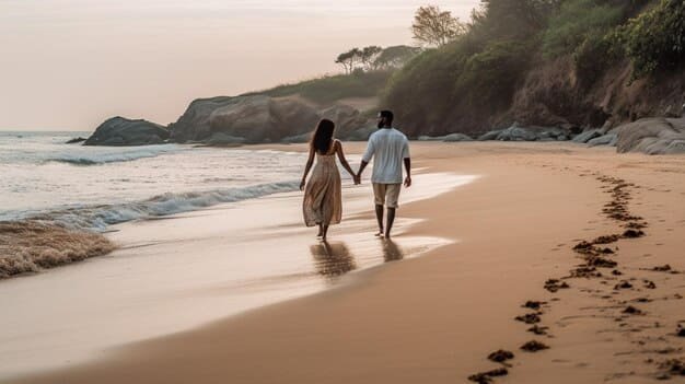 Couple walking on a romantic Sri Lankan beach during sunset on a honeymoon vacation