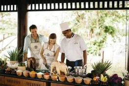 Visitors learning authentic Sri Lankan cooking with a local chef during a cultural cooking class