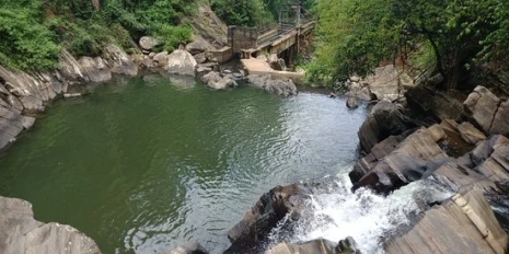 Natural rock pool and waterfall at Wattegama near Knuckles Mountain Range in Sri Lanka